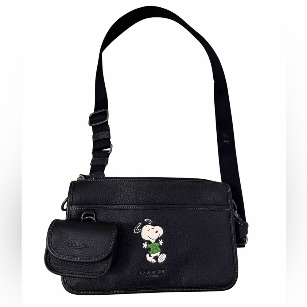 Coach X Peanuts Heritage Convertible Crossbody bag featuring a Snoopy motif.